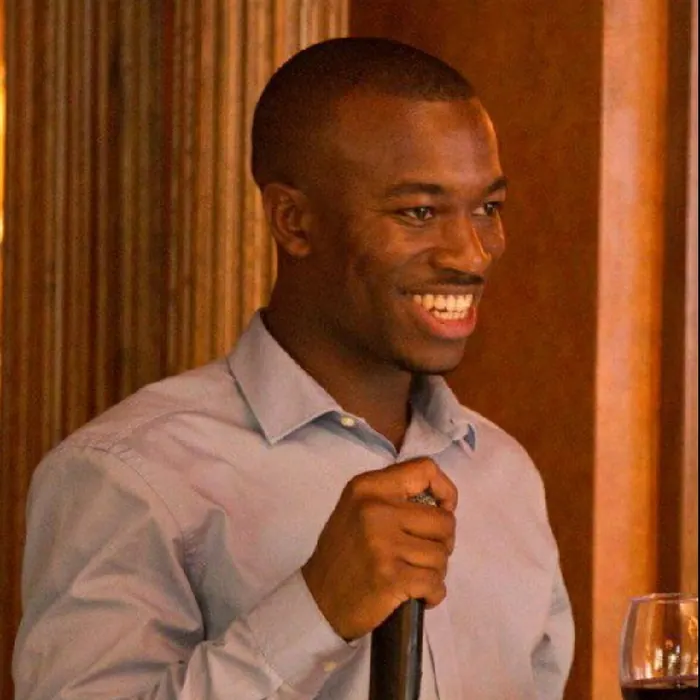 Portrait of Darrell Edwards holding a microphone